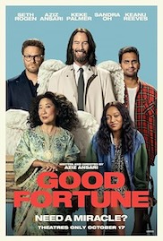 Film poster for "Good Fortune," a film written and directed by Aziz Ansari. Five actors appear against a pale blue background: Keke Palmer, Sandra Oh, Aziz Ansari, Seth Rogen, and Keanu Reeves, with Reeves at the center wearing angel wings, a tan trench coat, and a tie. The title "GOOD FORTUNE" sits in large red and cream lettering near the bottom, above the tagline "NEED A MIRACLE?"